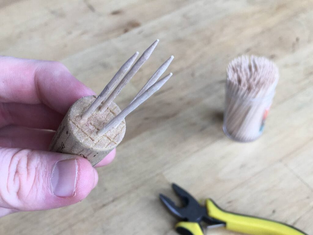 A cork with toothpicks sticking out